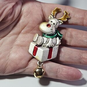 JMC reindeer on a christmas gift 2.5" X 1" Christmas pin